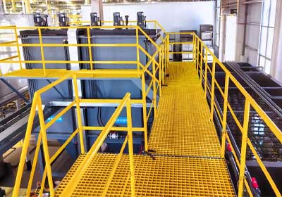 Close-up of GRP stair tread covers installed in an industrial facility in the UK