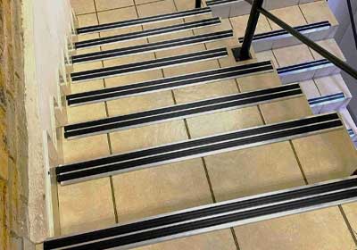 Close-up of anti-slip aluminium stair nosing installed on indoor steps for safety and grip – {siteName}