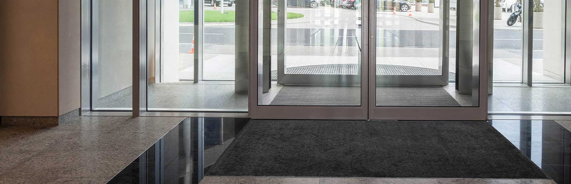 {siteName} logo with safety products including PPE, stair nosings, and tools displayed against a UK warehouse backdrop